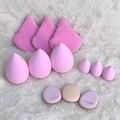 Set of 12 pink makeup sponges and finger puffs arranged on a soft white plush background - Pink 12-Piece Set
