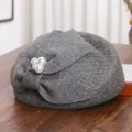 Elegant grey wool beret with veil, bow, and pearl accents on a wooden background - M (56-58cm) / Gray