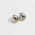 Polished silver oval stud earrings with gold pins in a modern minimalist pebble design - Ellipse / Silver
