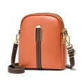 Chic orange PU leather crossbody bag with brown accents and elegant gold hardware - Orange