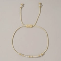Handmade woven bead bracelet with champagne beads and adjustable cord in white - April-Clear Quartz