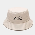 Close-up of beige cotton bucket hat with black moon and star embroidery detail - M (56-58cm) / Beige