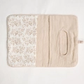 Detail of baby crib organizer showing floral quilted cotton and baby wipes dispenser pocket - Light Khaki Leaves + Solid Color