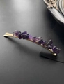 Close-up of natural purple amethyst stones on a golden minimalist hair clip base - Gold & Amethyst