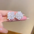 Macro shot of 3D white flower stud earrings with layered petal textures and matte finish - 23# White 3D Matte Petal Studs (HE15735)