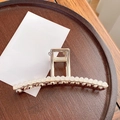 Elegant silver metal hair claw clip featuring refined white pearls on a dark wood tray - T-Shaped Claw Clip - 11.5cm
