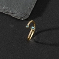 Macro detail of golden evil eye open ring featuring blue enamel and sparkling cubic zirconia - S-Micro-set Blue Eye Zircon