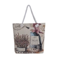 Detail of woven tapestry tote bag with rope handles and floral pattern on white background - Lavender