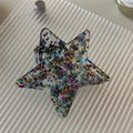 Detailed view of a star-shaped hair claw clip filled with colorful glitter and sequins - Small Confetti Stars Claw Clip