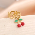 Detail of gold cherry pendant ring with red enamel fruit and hollow cross pattern - Cross Bead Style (J-2005)