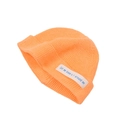 Detail of bright orange knitted beanie featuring a white fabric patch with blue text - Orange