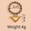 Detail of beaded elastic ring featuring gold heart lock charm and dimension markings - Multicolor Bead Heart Lock Style (F-R584)