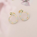 Close-up of golden snake earring with blue enamel scales and sparkling zircon accents - Blue