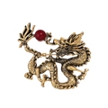 Vintage gold dragon brooch with intricate scales and a round deep red bead accent - Antique Gold/Red Bead