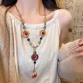 Collana lunga etnica con perline in ceramica colorate e anelli in legno decorativi - 61# Collana - Multicolore