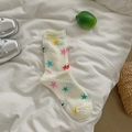 Off-white crew socks with colorful star patterns and a cute yellow puppy label - Colorful Star