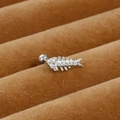 Macro shot of silver fish bone ear stud featuring sparkling micro-set white zircon stones - Fishbone Style