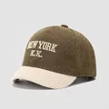 Detailed close-up of green wool cap with beige corduroy brim and New York embroidery - 50cm / NEWYORK-Green