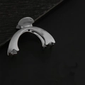 Polished silver metal hair claw clip with sleek curved design on black leather texture - Arc / Silver