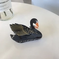 Detailed view of elegant black swan hair claw clip with golden wing outlines and glossy finish - New Black Swan (8cm)