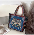 Ethnic navy canvas tote bag featuring elephant embroidery and colorful geometric patterns - Sky Blue Elephant