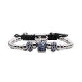 Detail of silver crown charm with blue zircon stones on black braided adjustable bracelet - Blue Zirconia Silver Crown Bracelet