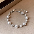 Macro detail of French style pearl bracelet with silver beads and lobster clasp - 5# Bracelet - Silver - Pink