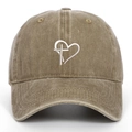 Detail of embroidered heart and cross on washed cotton khaki baseball cap - One Size / Khaki