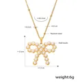 Collier nœud en acier titane doré avec perles de nacre et dimensions de taille - Collier Imitation Perle Nœud Papillon Or / Or