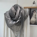 Elegant grey cotton linen scarf with lace detail draped on a white sweater - Gray