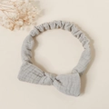 Detail of light gray muslin cotton baby headband with soft bow and elastic fabric texture - Light Gray