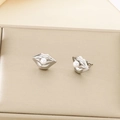 Macro shot of silver lip-shaped earrings featuring a white pearl on a gold textured background - Steel Color 16*11mm Creative Lip Pearl Style (KE115794-GC)
