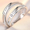Macro shot of silver couple rings with I love you and 1314 engraving on champagne silk - Love You for Life