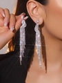 Sparkling long tassel heart earrings with silver rhinestones on a female model - Silver Round Rhinestone Tassel