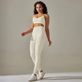 Detail of seamless ribbed knit texture on high waist yoga leggings and sports bra - S / Top And Bottom / Cami Bra + Long Pants / Off White