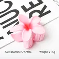 Pink frangipani flower hair claw clip with matte finish for summer beach vacation style - Pink