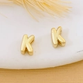 Minimalist 18K gold plated copper earring with elegant letter K design on white tray - Gold Letter K
