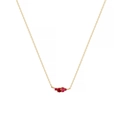 Detail of a thin gold chain with a red gemstone cluster pendant on white background - July / Ruby