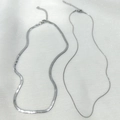 Detail of silver double-layered snake chains with lobster clasps and extension links - Steel Color Snake Chain + Blade Chain