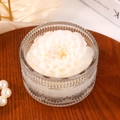 White floral scented candle in embossed glass jar with double wick on satin background - White Dahlia Shape