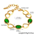 Detail of gold stainless steel bracelet with green oval Czech glass and measurement guide - Gold Green (TXE283)