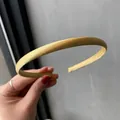 Slim yellow satin headband with smooth silk texture for a minimalist Korean hair style - Earthy Yellow