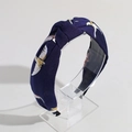 Detailed view of dark blue fabric headband with white bird print and center knot detail - Navy Blue Bird Print
