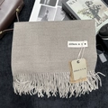Close-up of khaki cashmere-feel scarf texture with soft fringe and stylish brand tag - 200x68cm / Light Brown