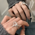 Vintage brushed 925 sterling silver knot ring with polished metallic finish on hand - Silver Knot Design Metal Ring (J5060)