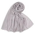 Close-up of light purple jersey wrap scarf showing elastic knit texture and fine overlock edge - Light Gray