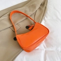 Fashionable bright orange leather underarm bag for women with sleek zipper detail - Orange