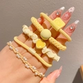 Five-piece yellow hair accessory set with pearls and heart charms for girls - Yellow