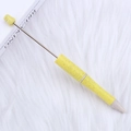 DIY yellow beaded ballpoint pen with gradient UV plating on white plush background - Eco Yellow