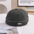 Detail showing distressed brim and metal logo plate on a charcoal washed docker hat - 55-58cm / Metal Label Style / Green